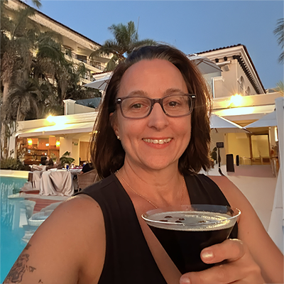 woman poolside with espresso martini in hand - Nicky Omohundro