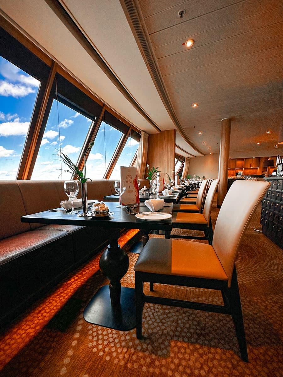 cruise ship dining overlooking blue sky