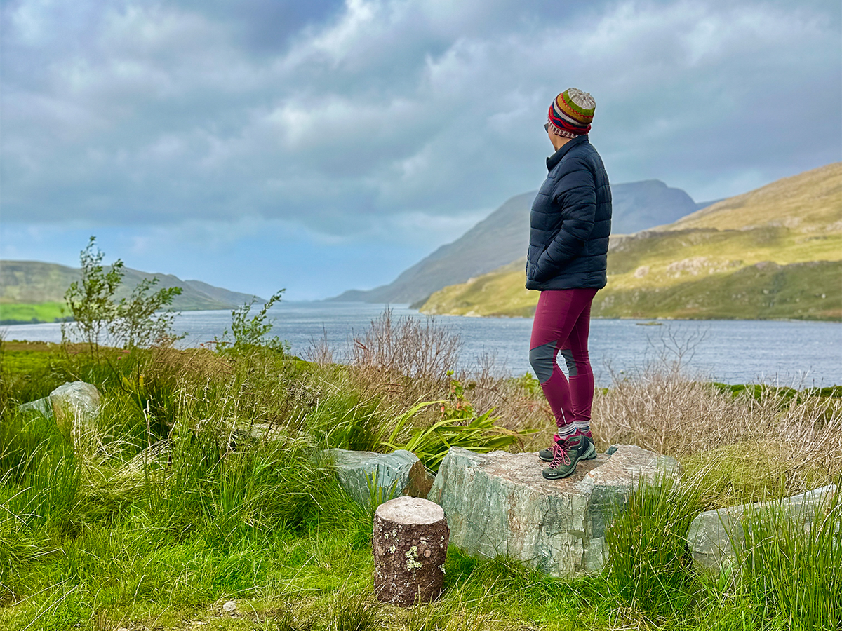 Killary Fjord view with a woman looking out on water