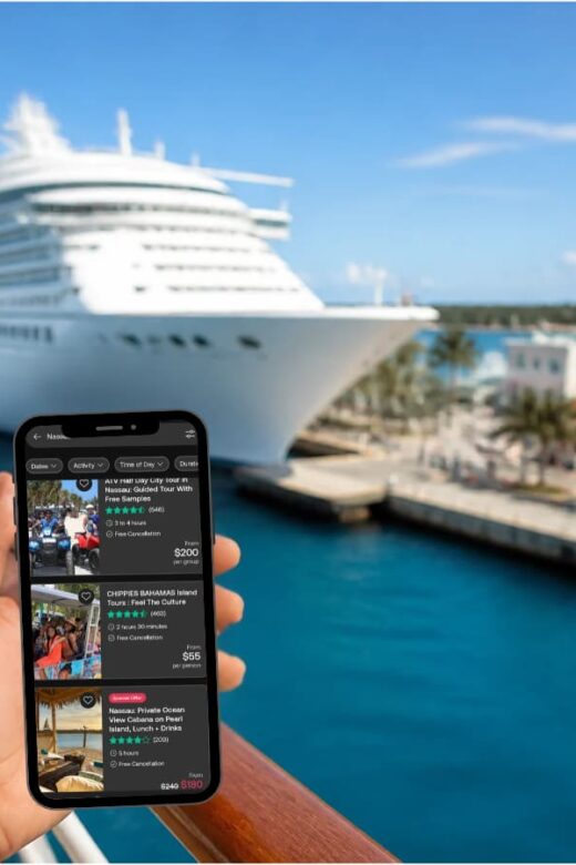 phone screen held in hand while looking at cruise ship